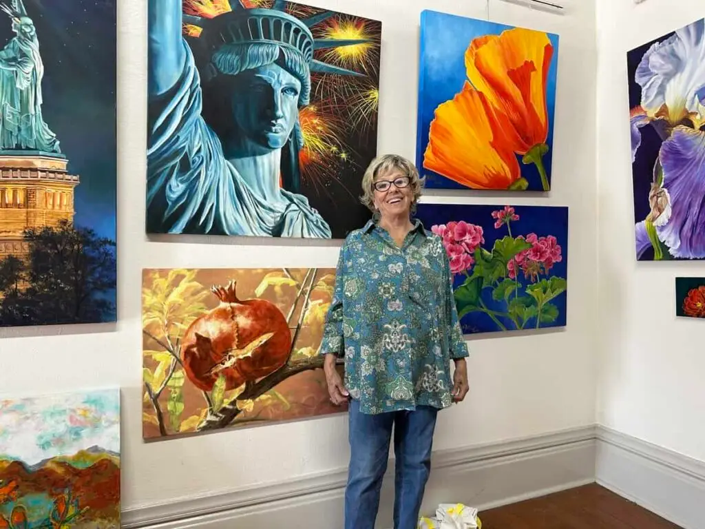 w mitchell tucker in front of paintings